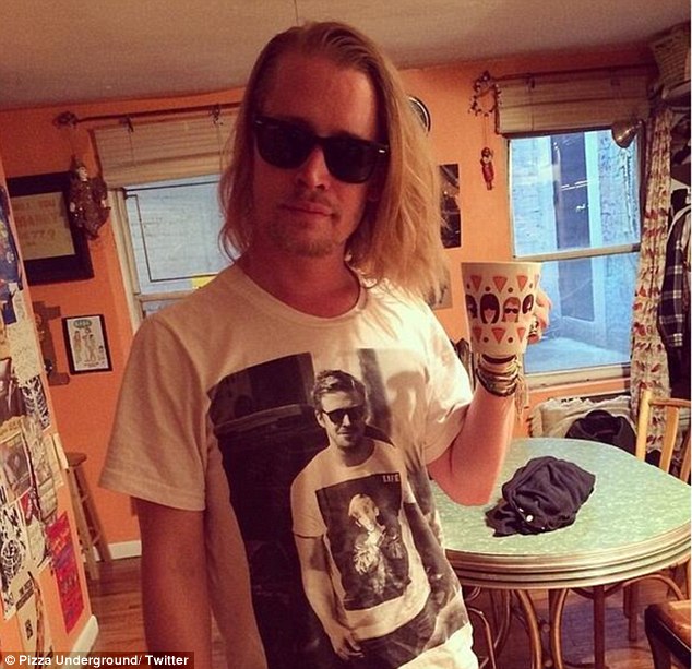 A picture of Macaulay Culkin wearing a t shirt with a pciture Ryan Gosling wearing a t shirt that has a picture of Macaulay Culkin